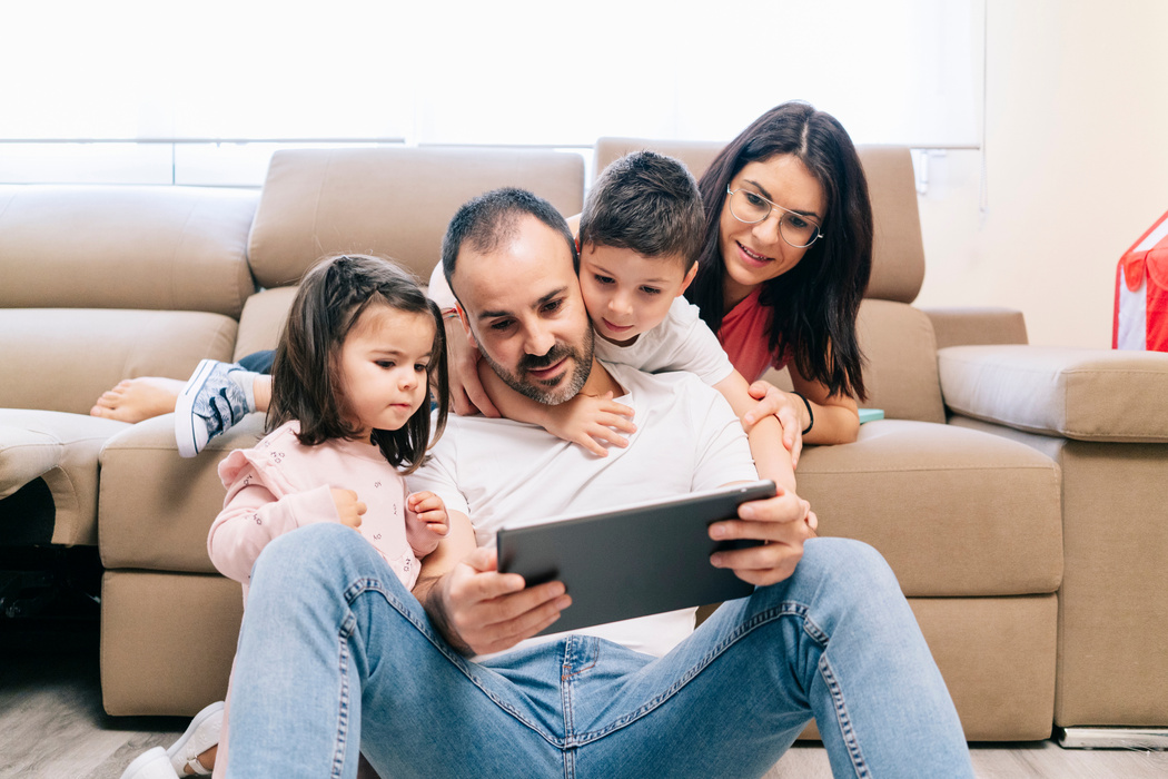 Family Watching on Their Tablet  